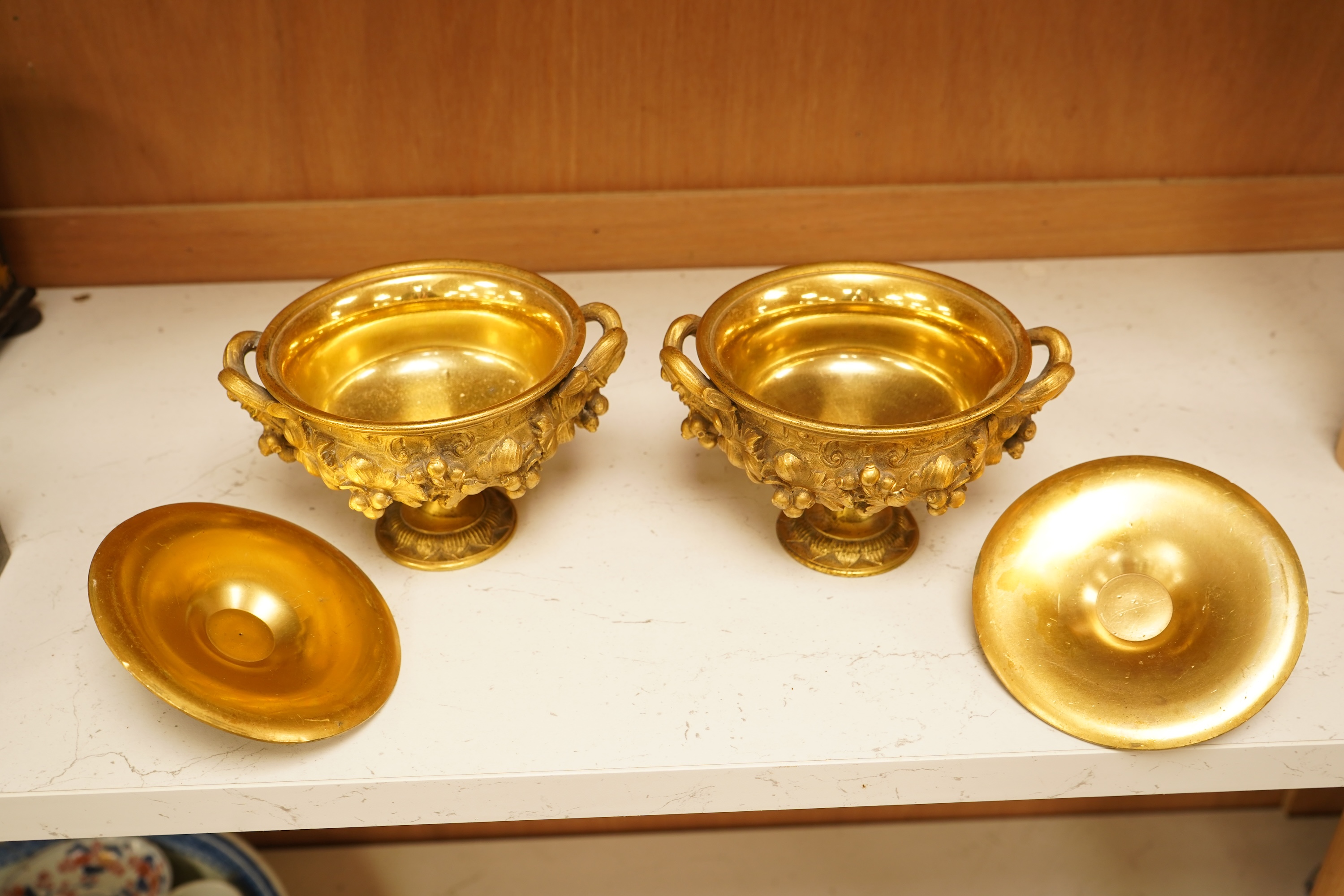 A pair of 19th century French ormolu lidded urns, 12cm